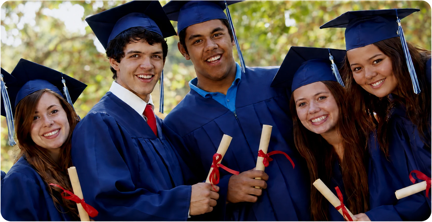 Five graduates celebrating their next chapter